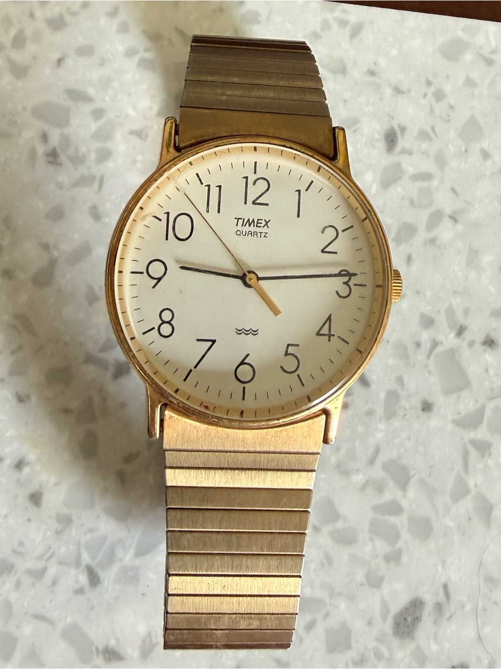 Timex Gold Tone Watch with White Dial and Black Numerals
